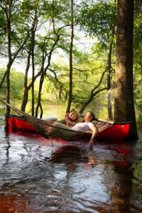 Blackwater Bliss Leave your cares behind on a leisurely downriver paddle to this secluded destination. Hammocks